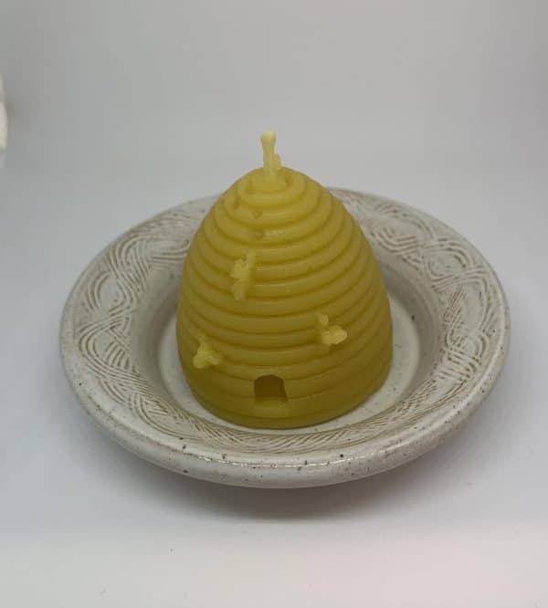 image of beeswax candle beehive and dish