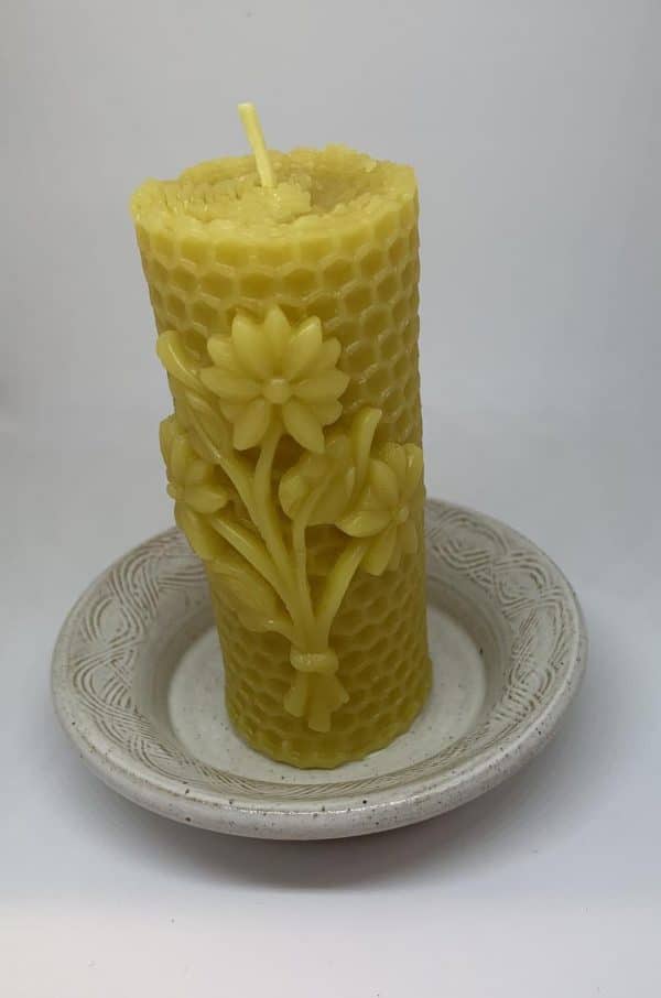 image of beeswax candle honeycomb flower and dish