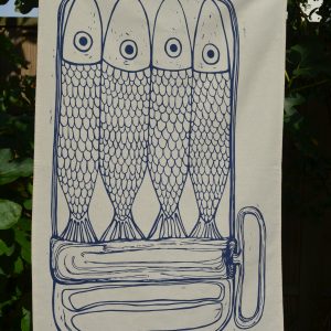 Organic tea towel with a design of sardines in a tin.