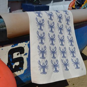 Organic cotton tea towel with lobster design.